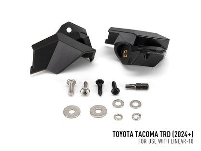 Pack LED calandre LAZER LAMPS pour Toyota Tacoma TRD 2024+ avec feux LED intégrés, montage sur la calandre du véhicule.